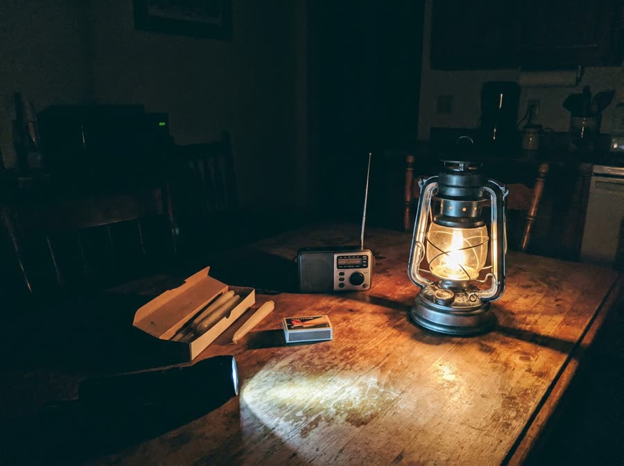 Storm lantern and outage kit on a kitchen table